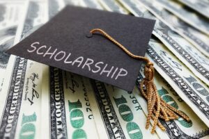  Scholarship cap on money, by zimmytws/stock.adobe.com 