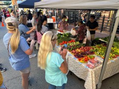 Farmers market visitors.