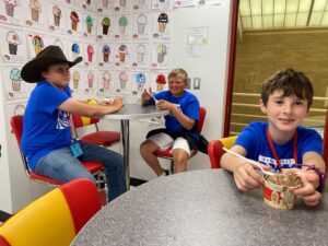 Children enjoying ice cream from Iowa State University.