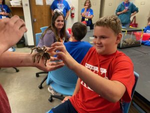 Children learning about spiders.